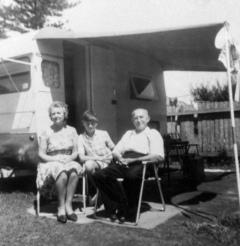 The Rhead family outside their 1960s caravan.